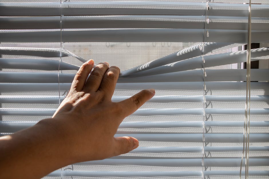 Hand smoothly opening an energy efficient window
